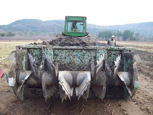 a farm machine with blades facing camera