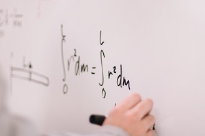 a math equation on a whiteboard